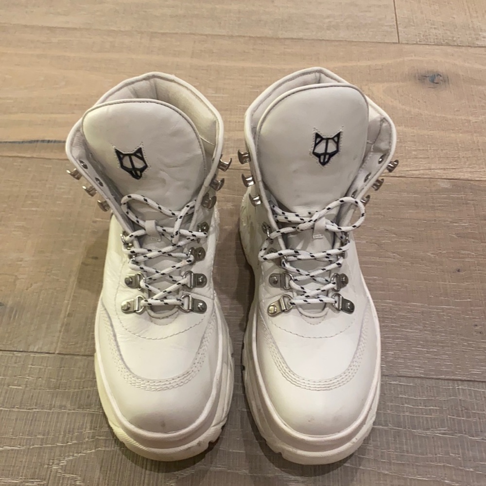 Spike leather stack sole lace up boots.